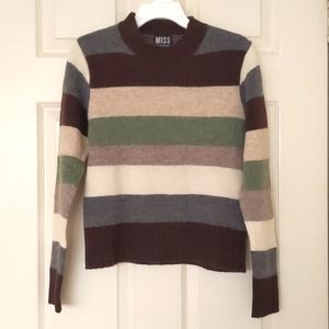 Girl's Wool crewneck sweater with multi color stripes.